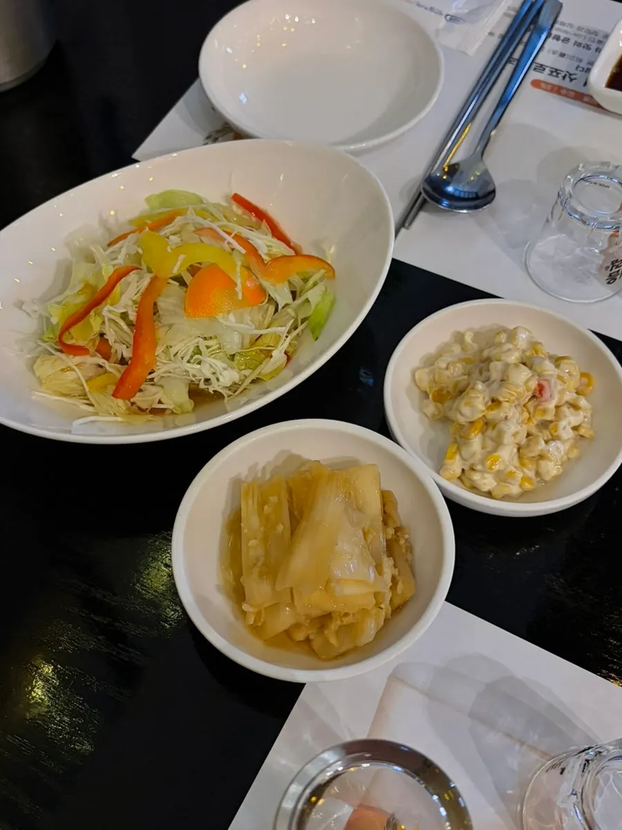 Basic side dishes: salad, aged kimchi, and corn salad