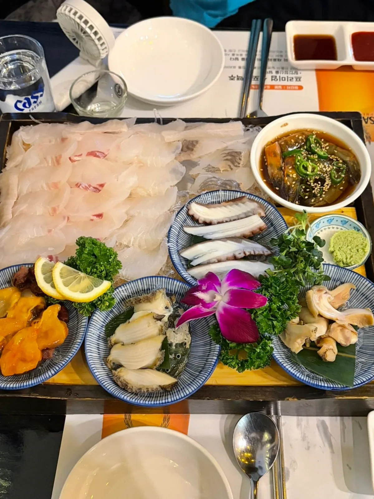 Damiseon sashimi platter with red seabream, olive flounder, and seasonal sashimi