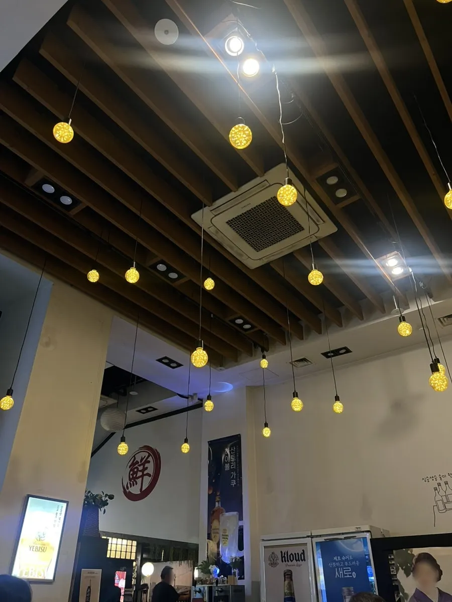 Interior of Damiseon Gangnam Station Branch with high ceilings