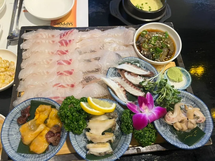 A plate of thickly sliced fresh sashimi