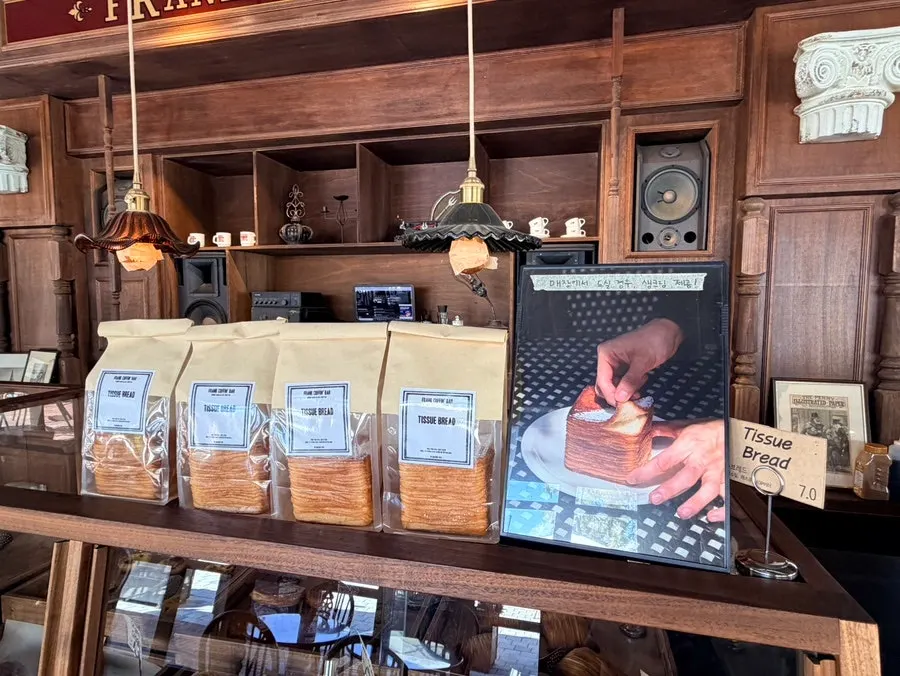 Full display case of morning bakery lineup