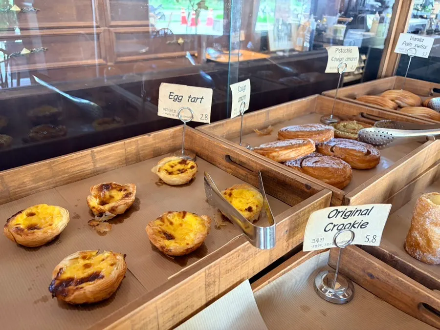 Egg tarts and croissants in the showcase