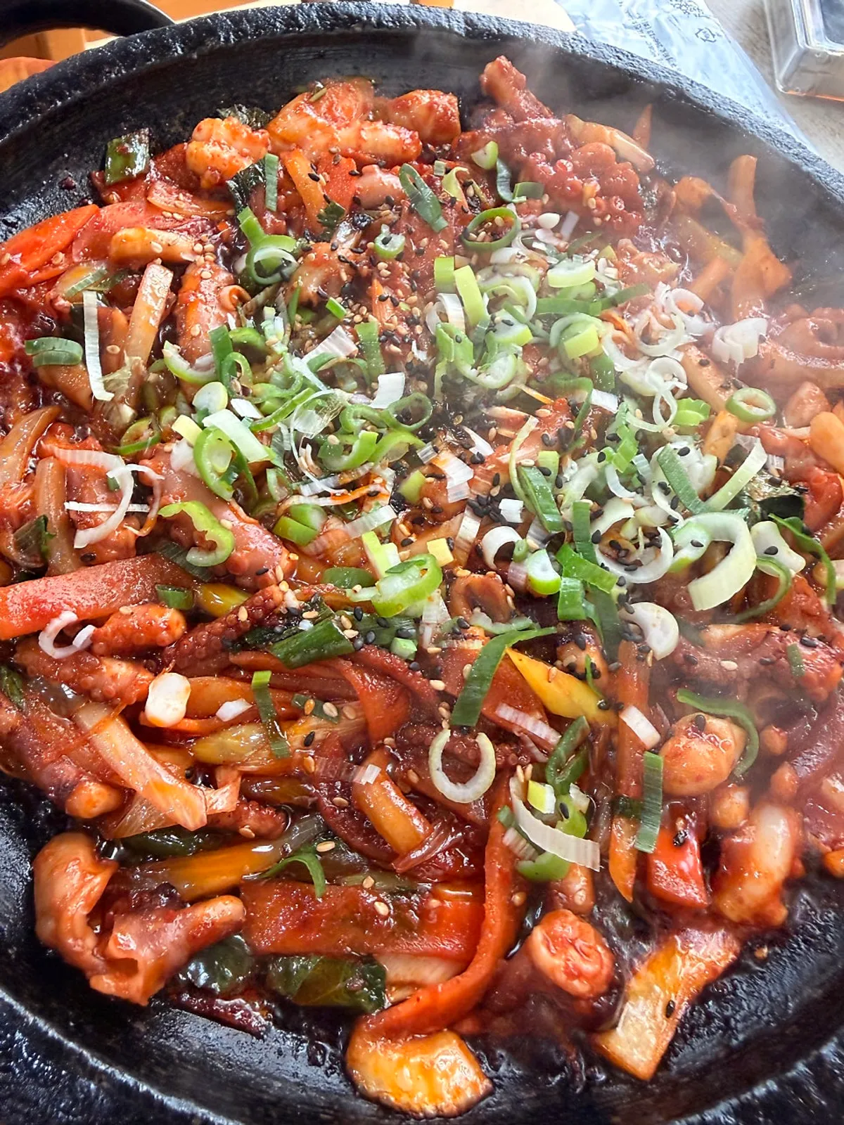 Hot-plate stir-fried octopus sizzling on the hot plate