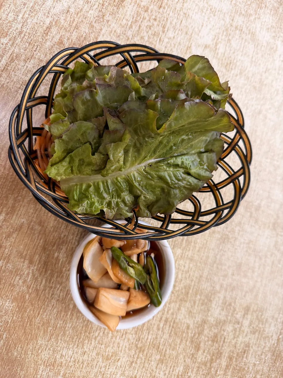 Assorted fry with lettuce and pickled onion set out on the table