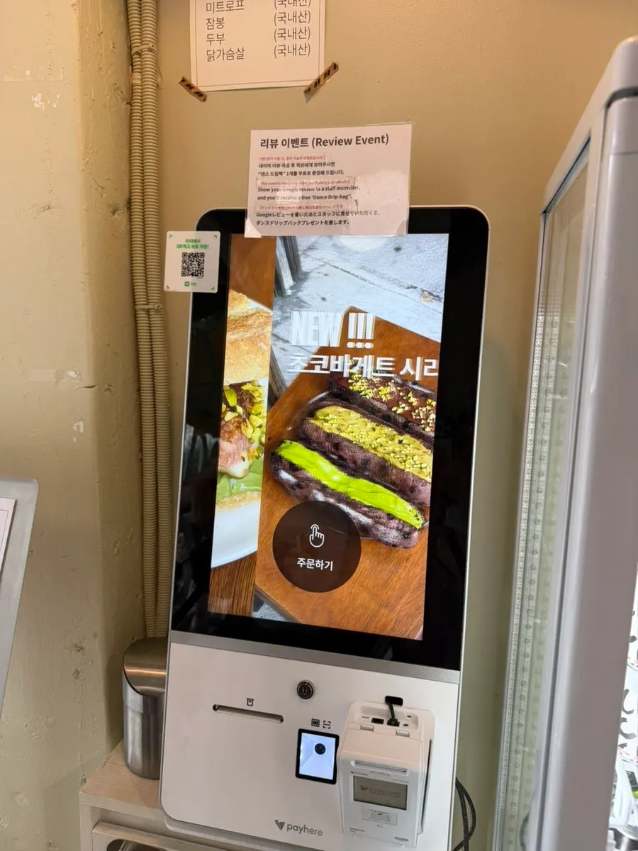 The narrow interior and order counter at Dance Dance Dance Hannam