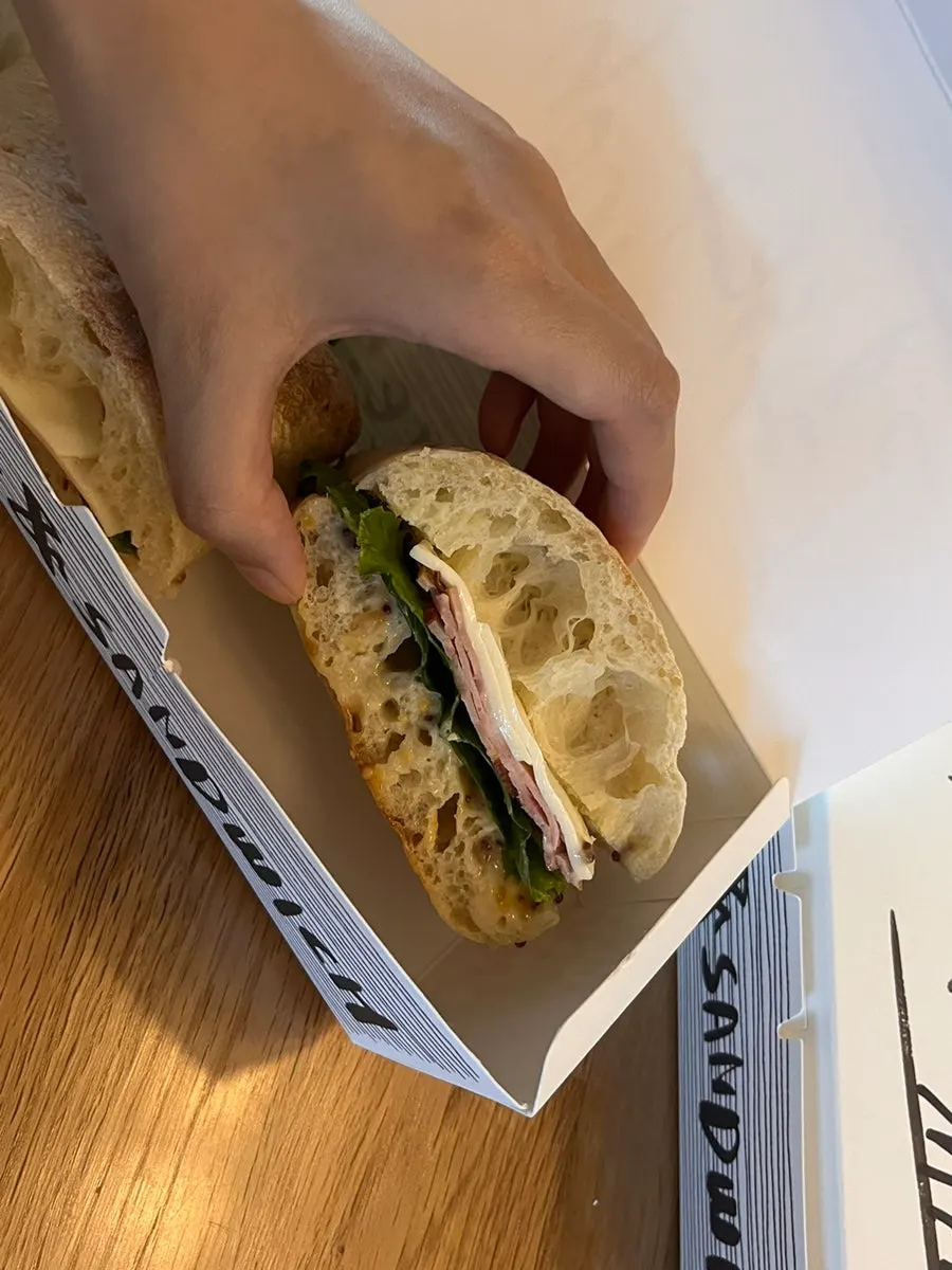 Cross-section of the sandwich with handmade ham and whole grain mustard
