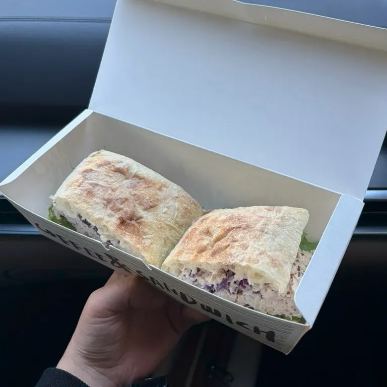 Eating the Charcuterie jambon sandwich inside the car