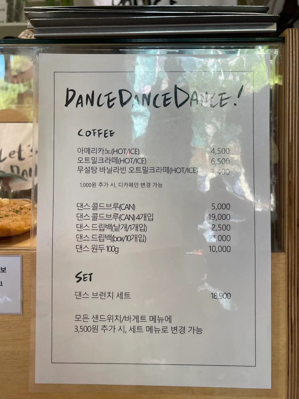 Menu board showing sandwiches, baguettes, desserts, and soup