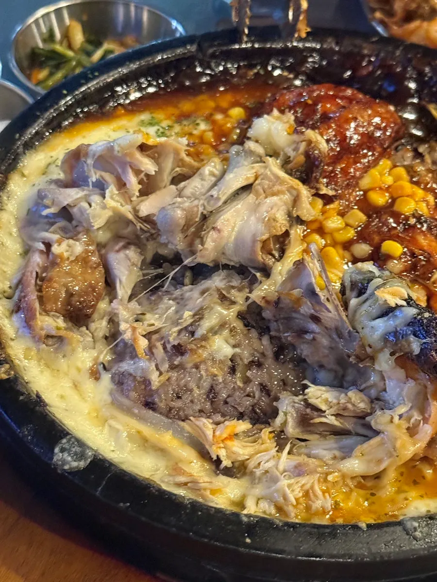 Nurungji chicken served on a stone plate