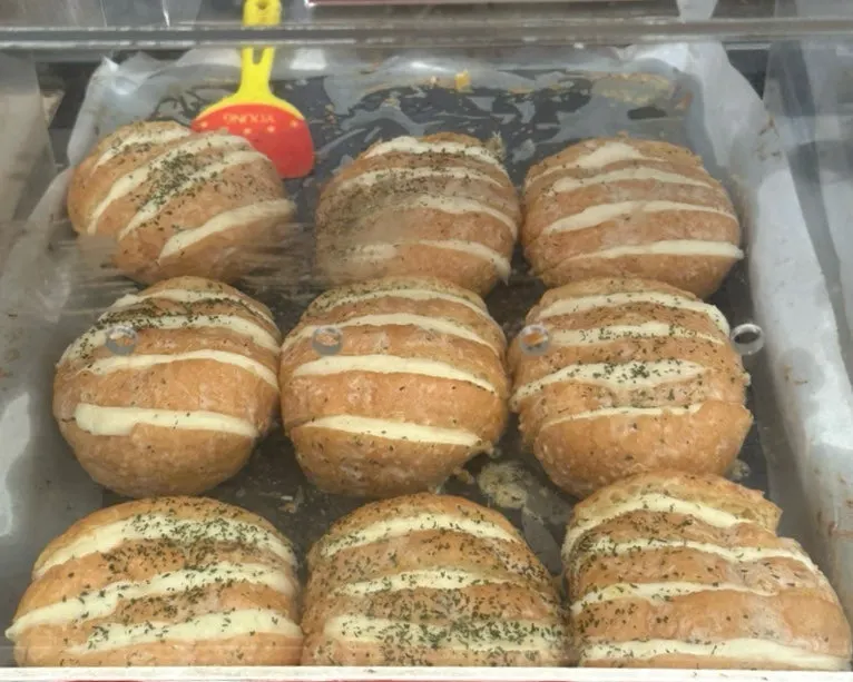 Garlic bread loaded with cream cheese on display