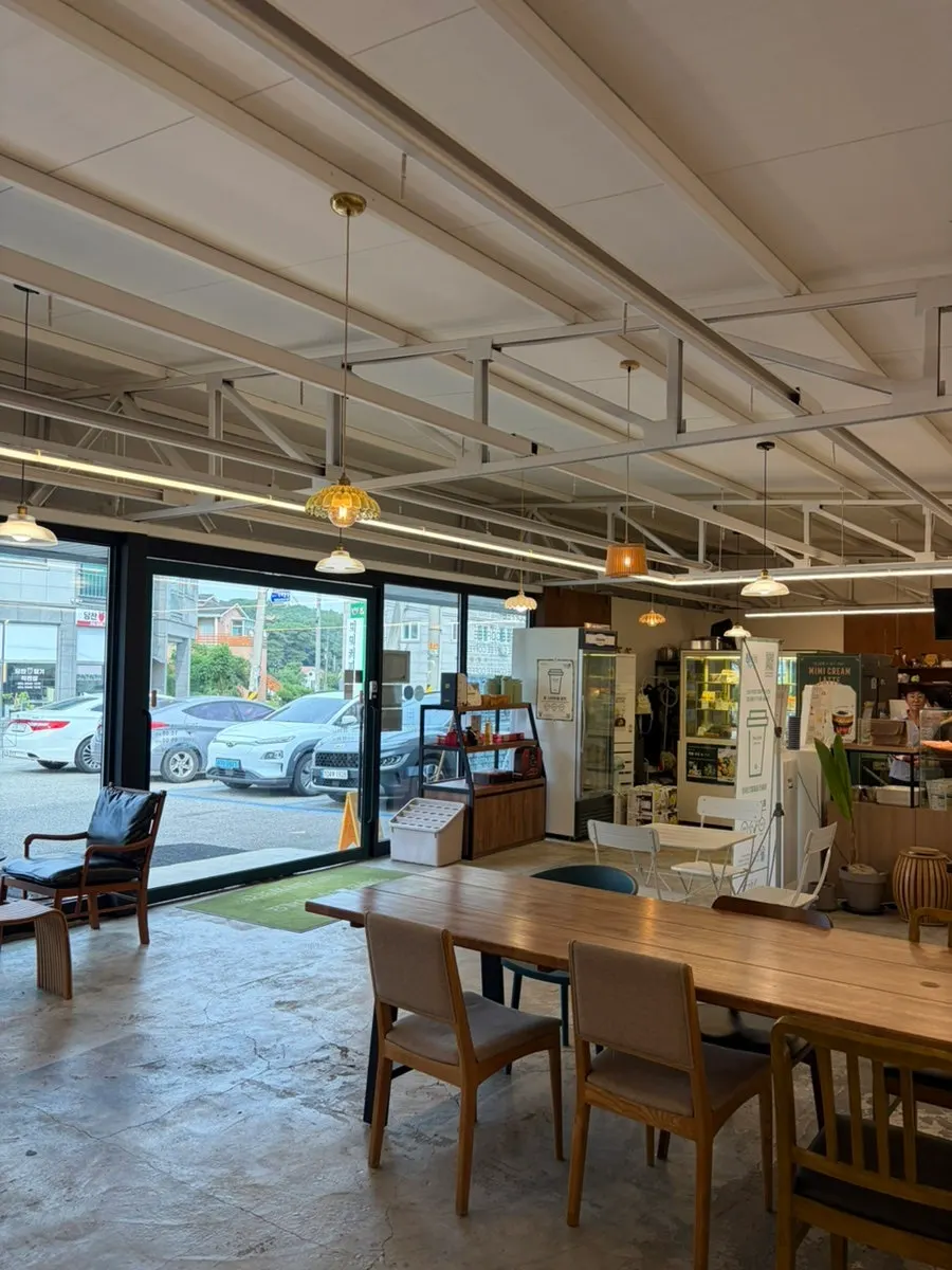 Large group table set up in the middle of the café