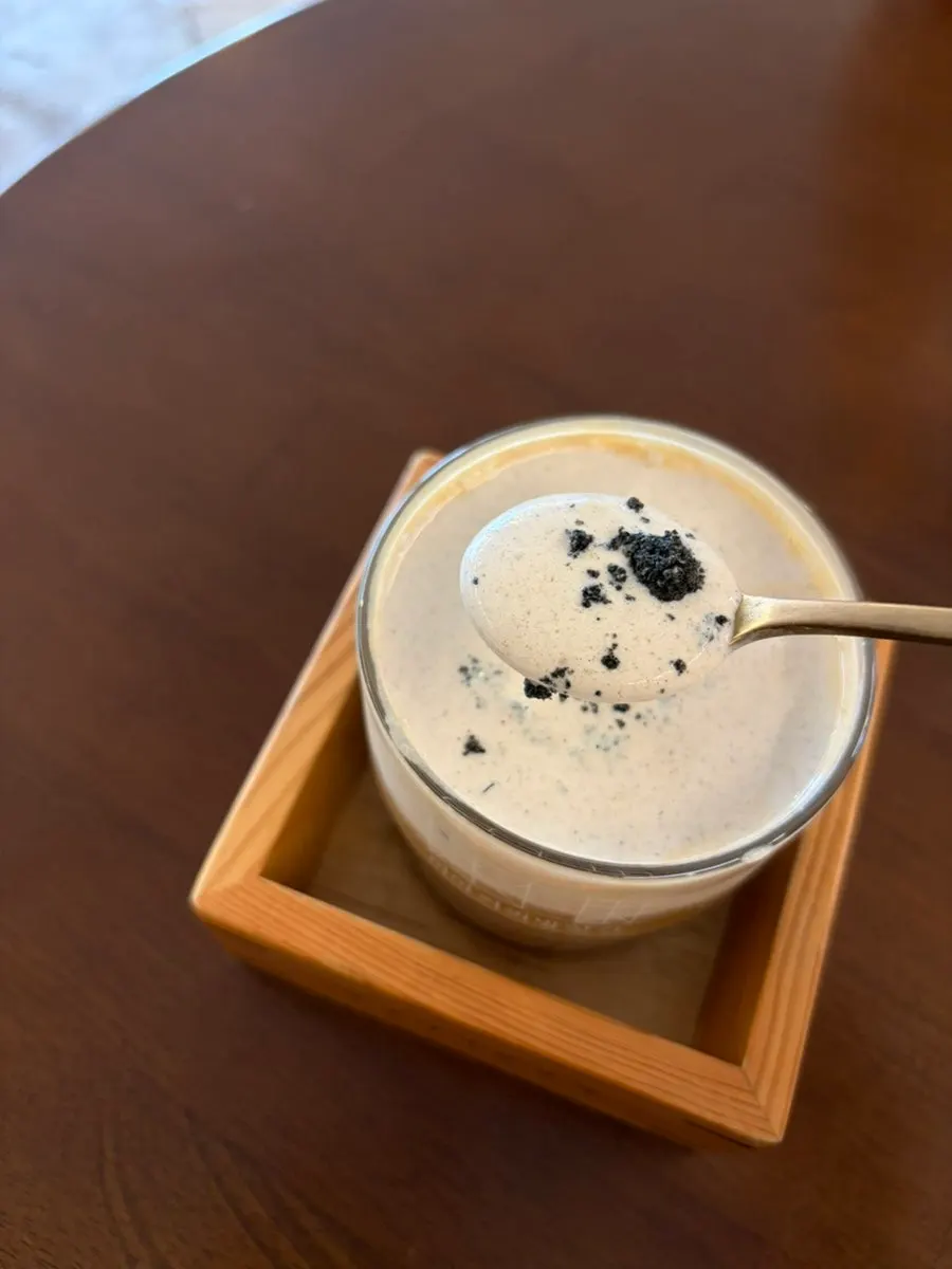 Misutgaru cream latte topped with black sesame powder