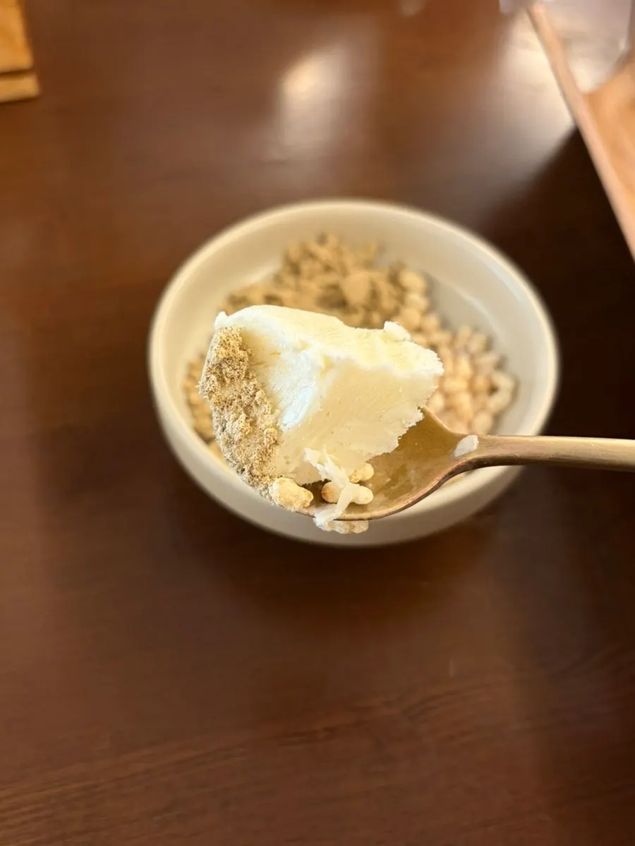 Tofu ice cream served with bean powder and rice crisps