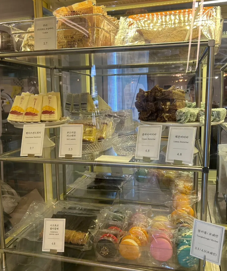Castella, lemon butter bars, and other baked goods on display