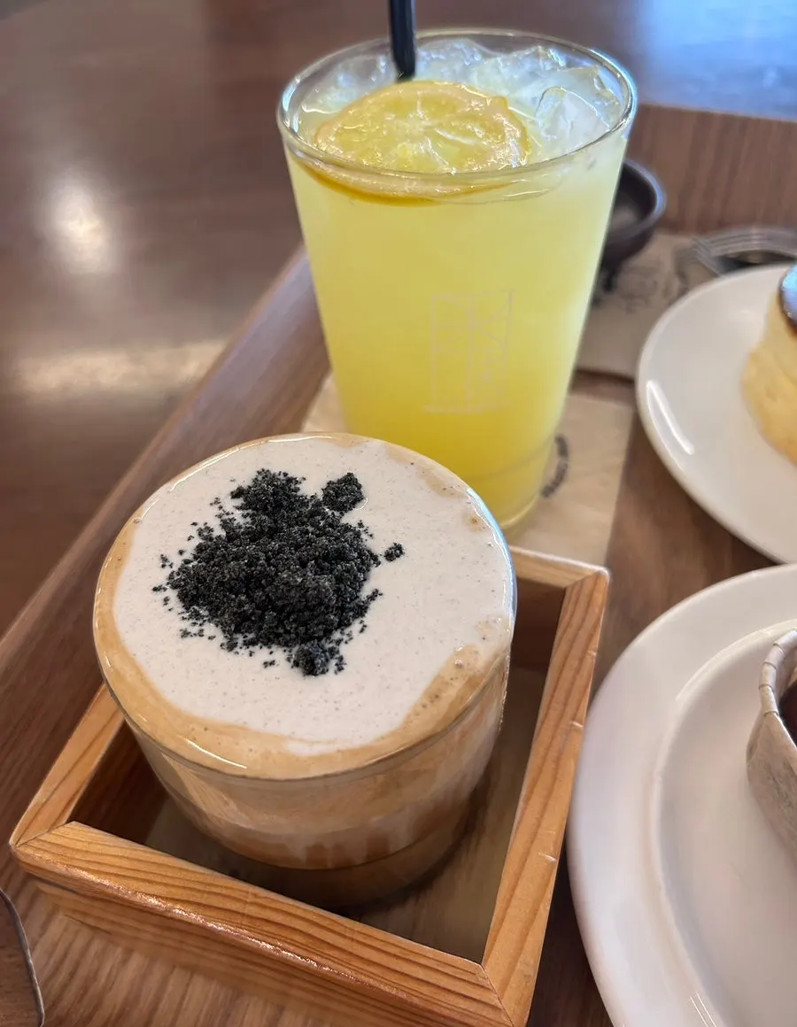 Five drinks and desserts laid out on the table