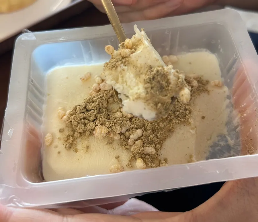 Sundubu ice cream topped with rice puffs and injeolmi powder