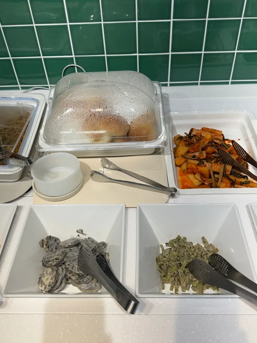 Assorted vegetable side dishes at the self-bar