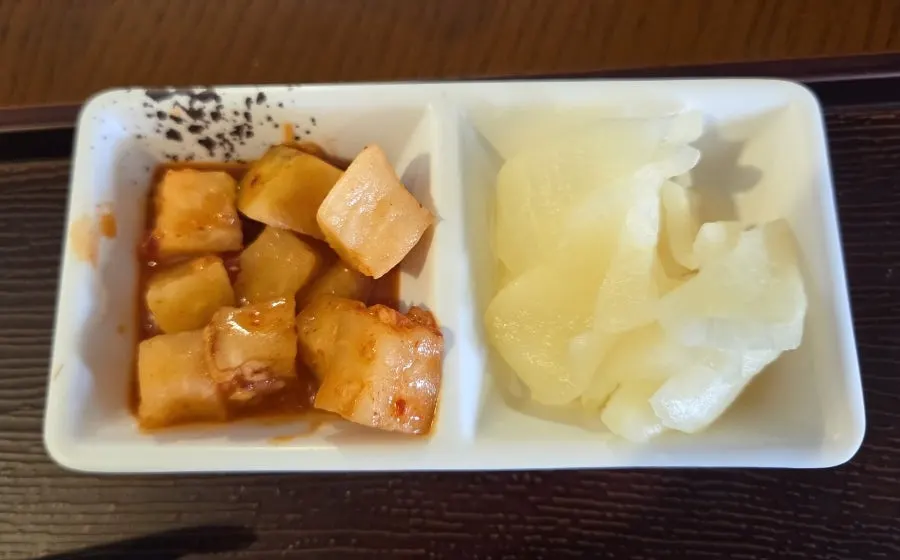 A plate of crispy fried tenderloin tonkatsu