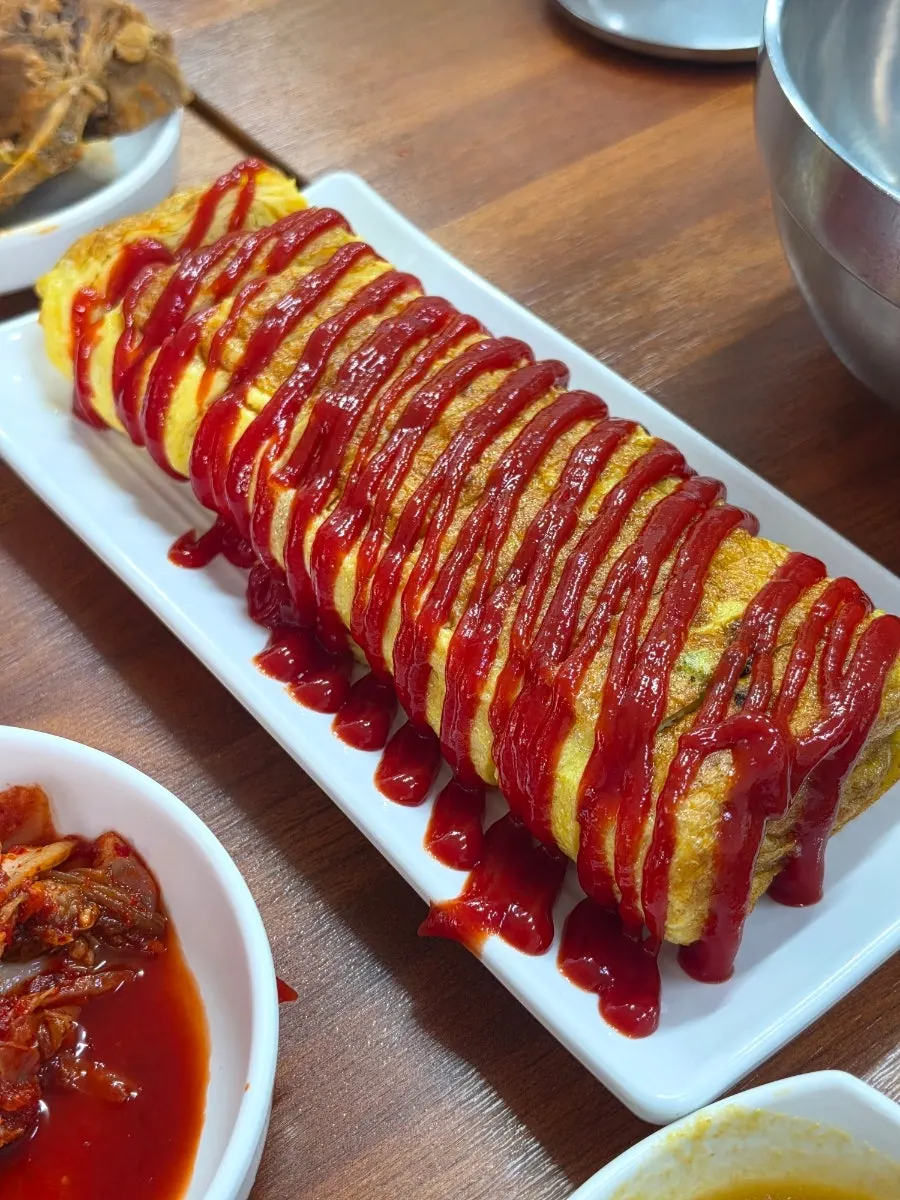 Egg roll and ketchup at Dangsan Ppyeodaegwi Haejangguk