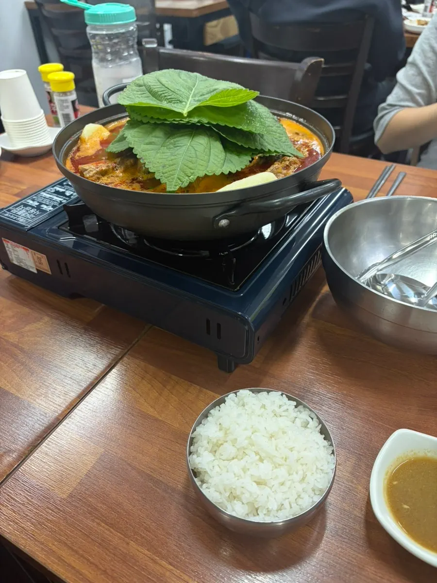 Spicy gamjatang simmering on the table