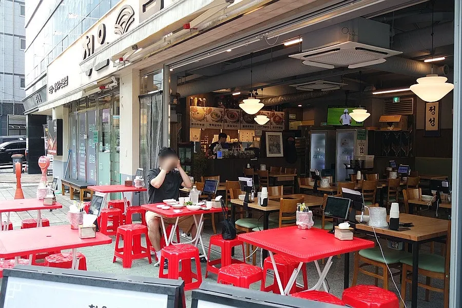 Patio seating at Cheongun Bossam Dangsan Branch before sunset
