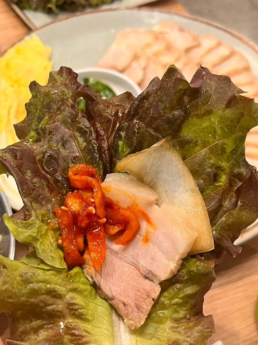 Five-layer bossam served with dried radish and pepper sauce