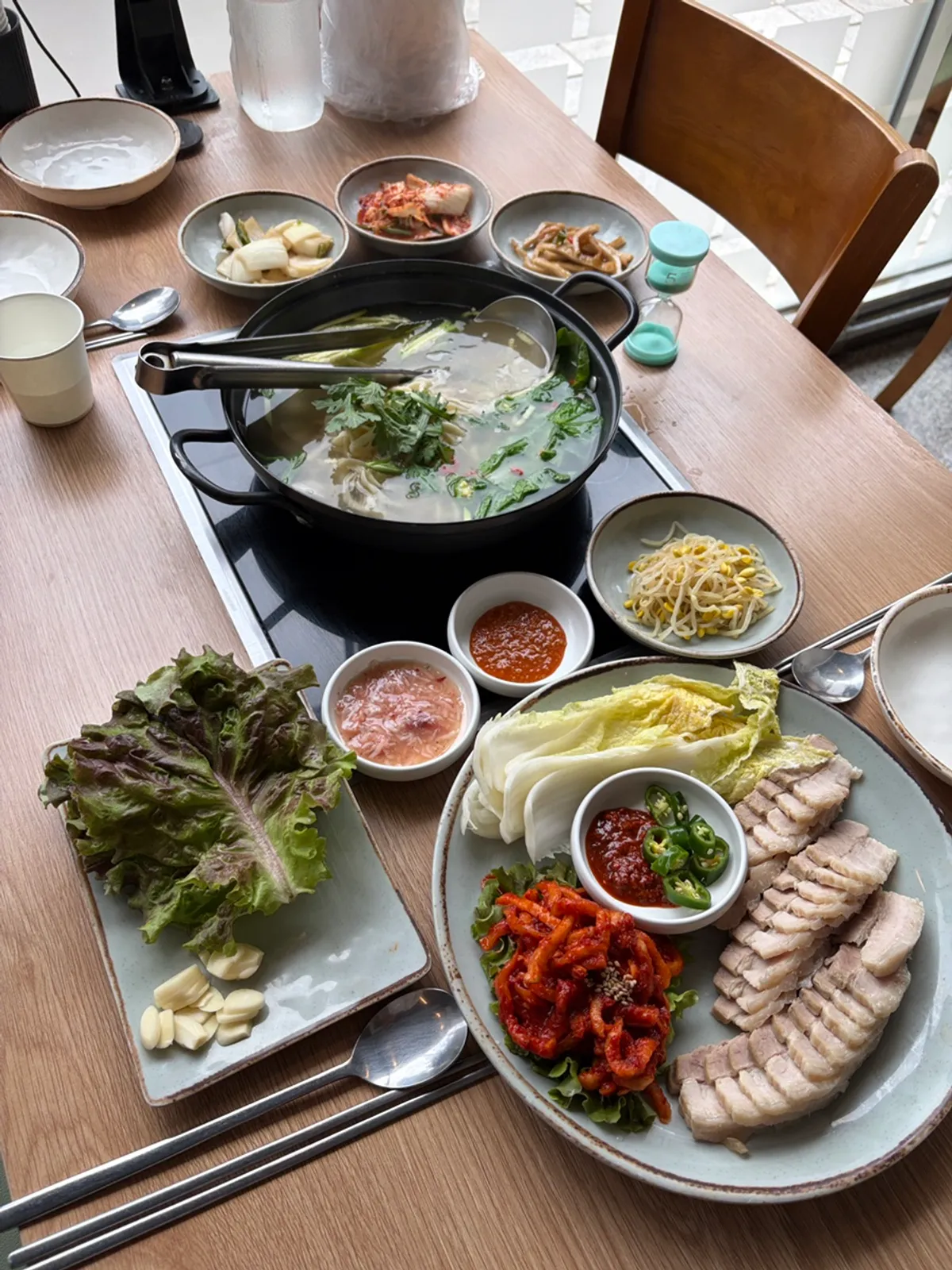 Full spread of bossam and kalguksu set at Cheongun Bossam Dangsan Branch