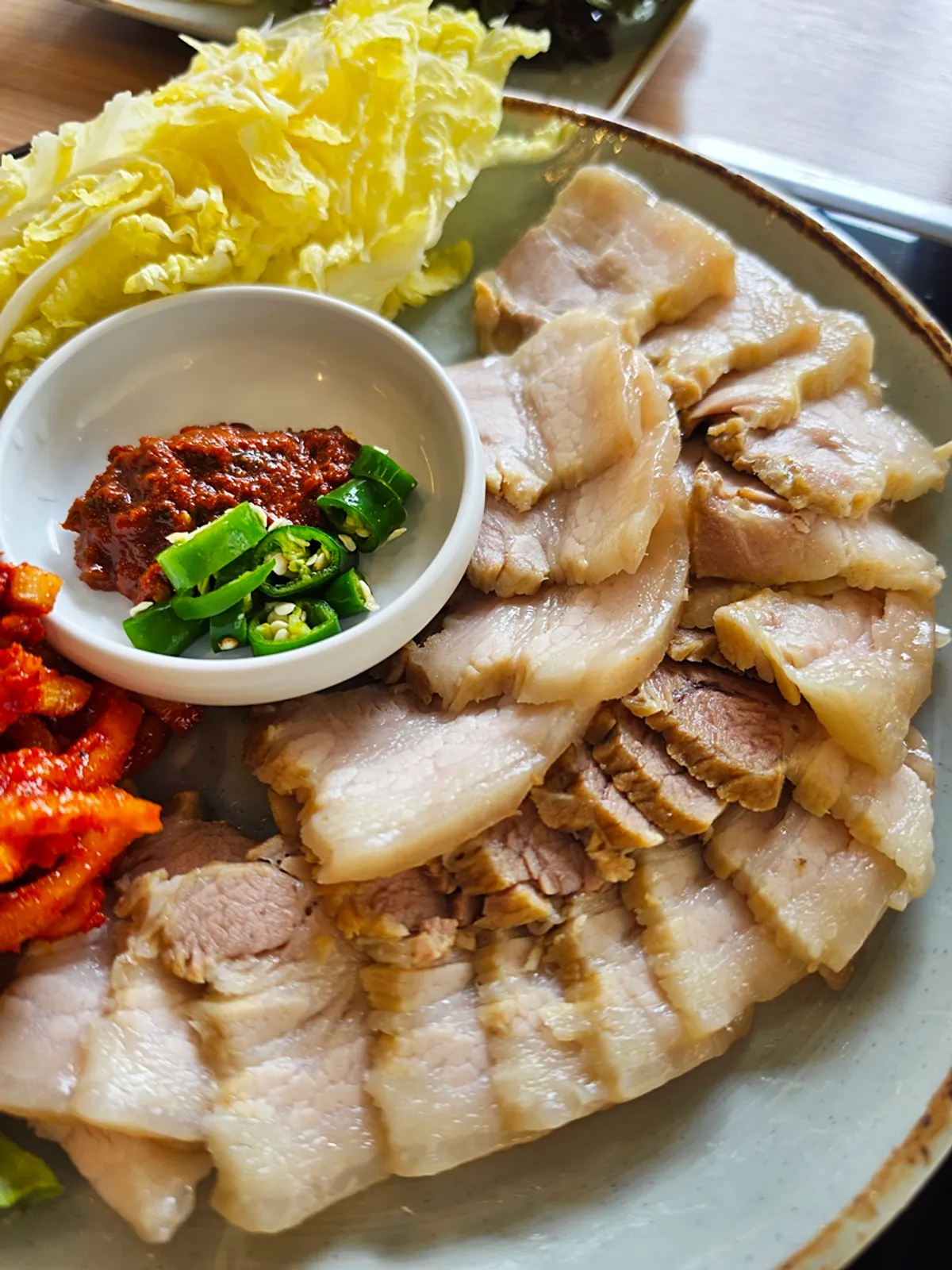 Plate of neatly arranged, moist five-layer bossam