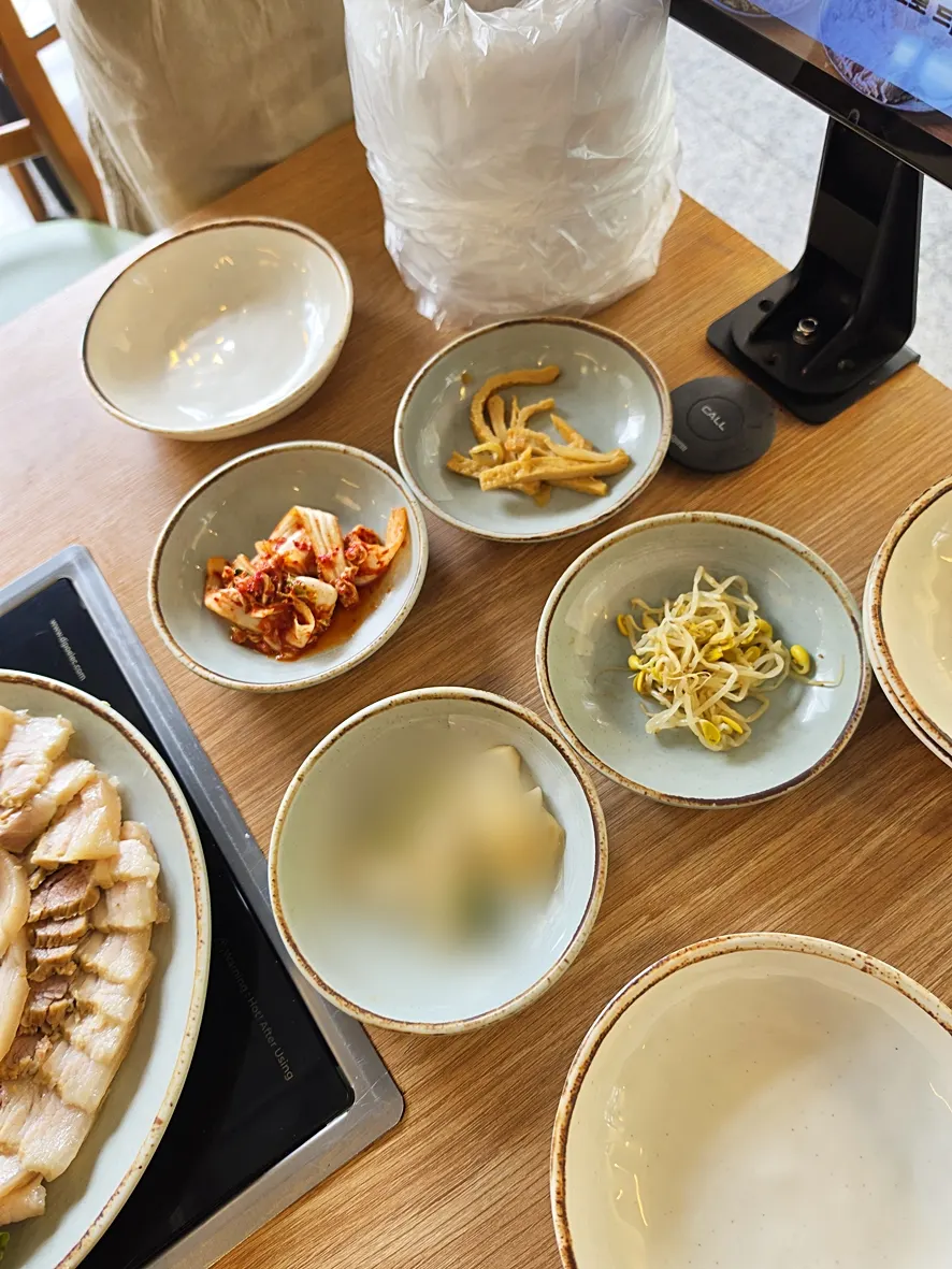 Cheongun Bossam's basic side dishes including pickled vegetables