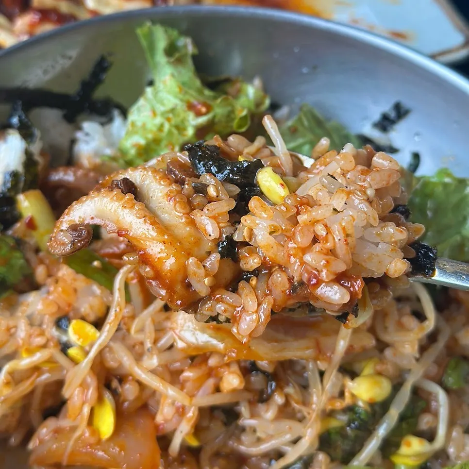 A spoonful of rice mixed with octopus