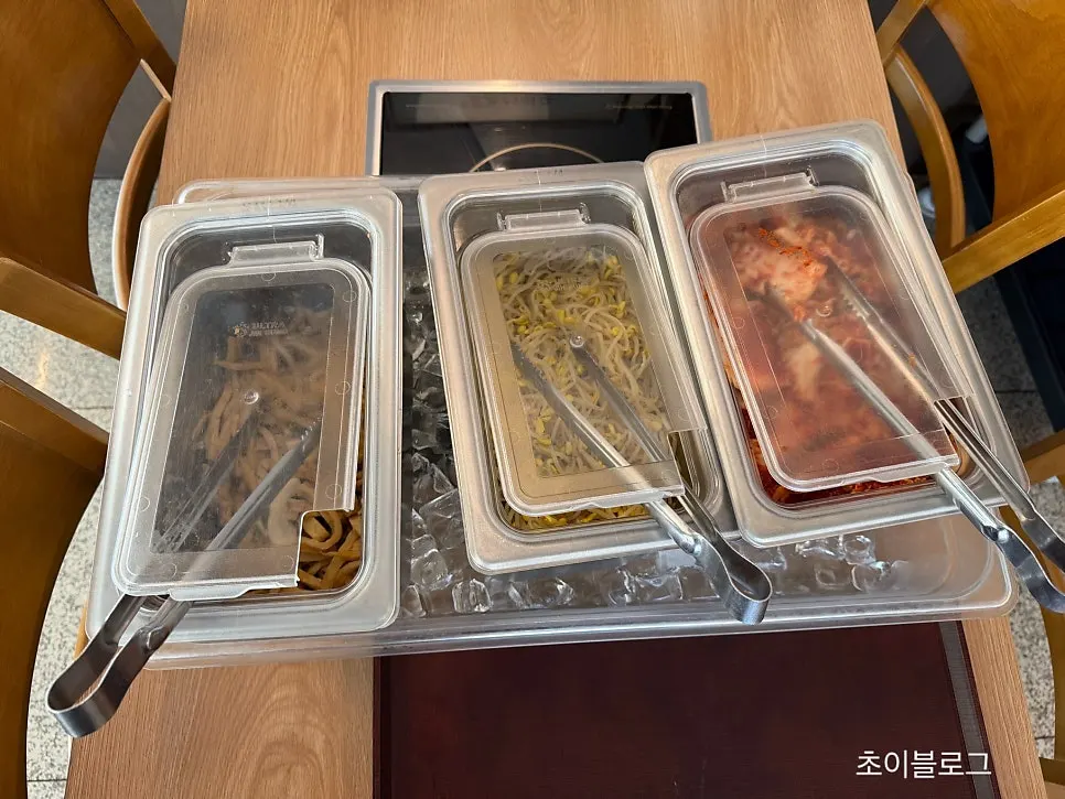 Plates of kimchi and pickled onion side dishes