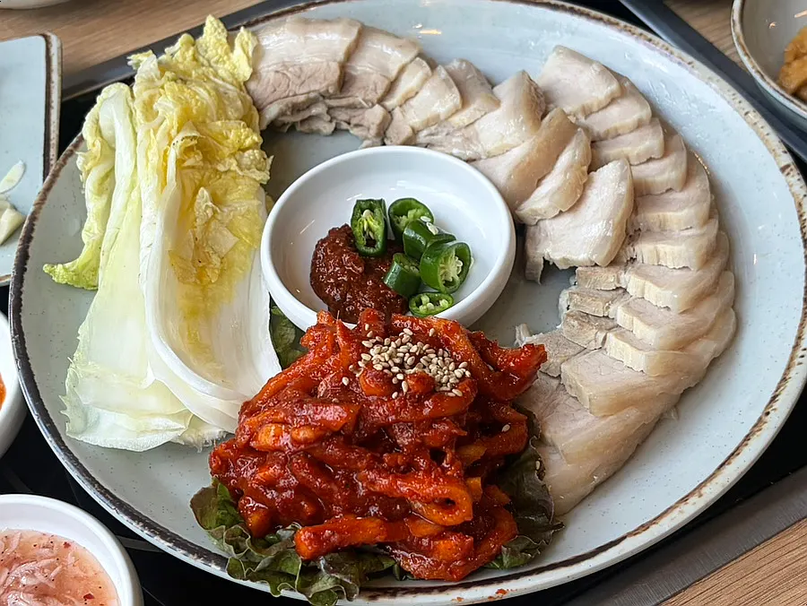 Five-layer bossam served with bossam kimchi and salted cabbage