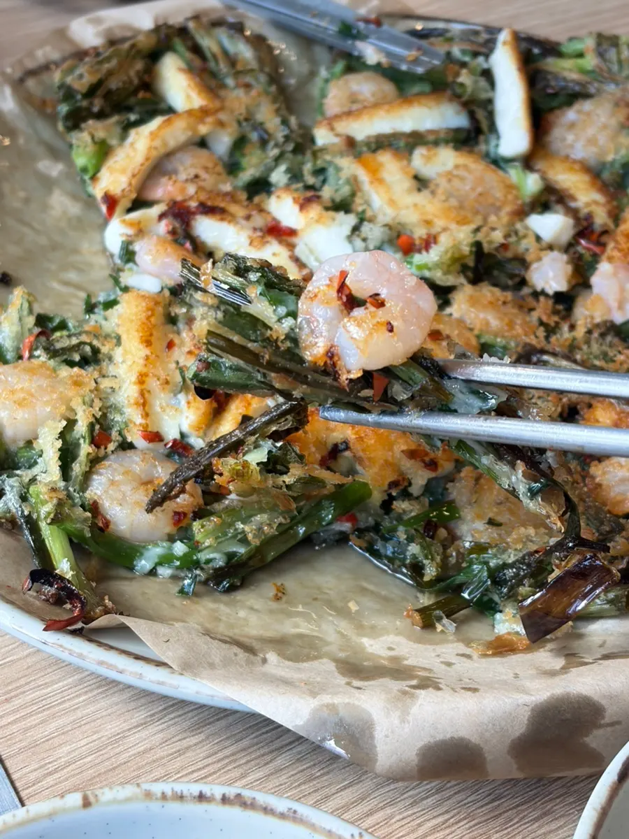 Seafood pancake studded with peperoncino and hot peppers