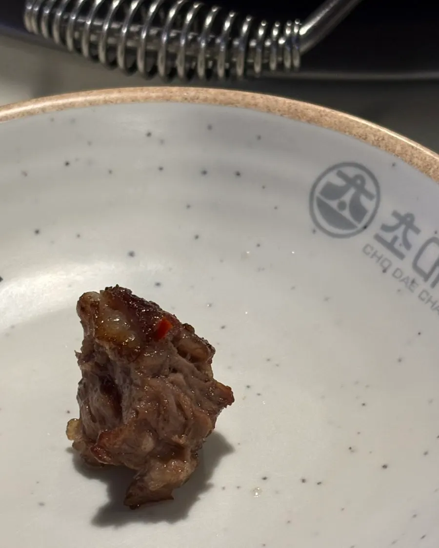 A golden, well-grilled piece of salted galbisal