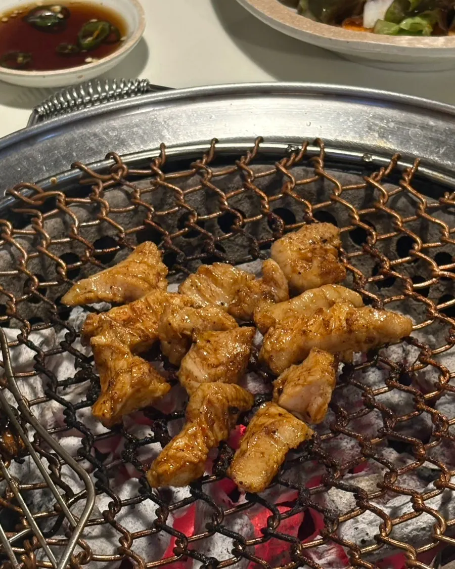 Chodaechang's teuk-yang grill cooking over charcoal