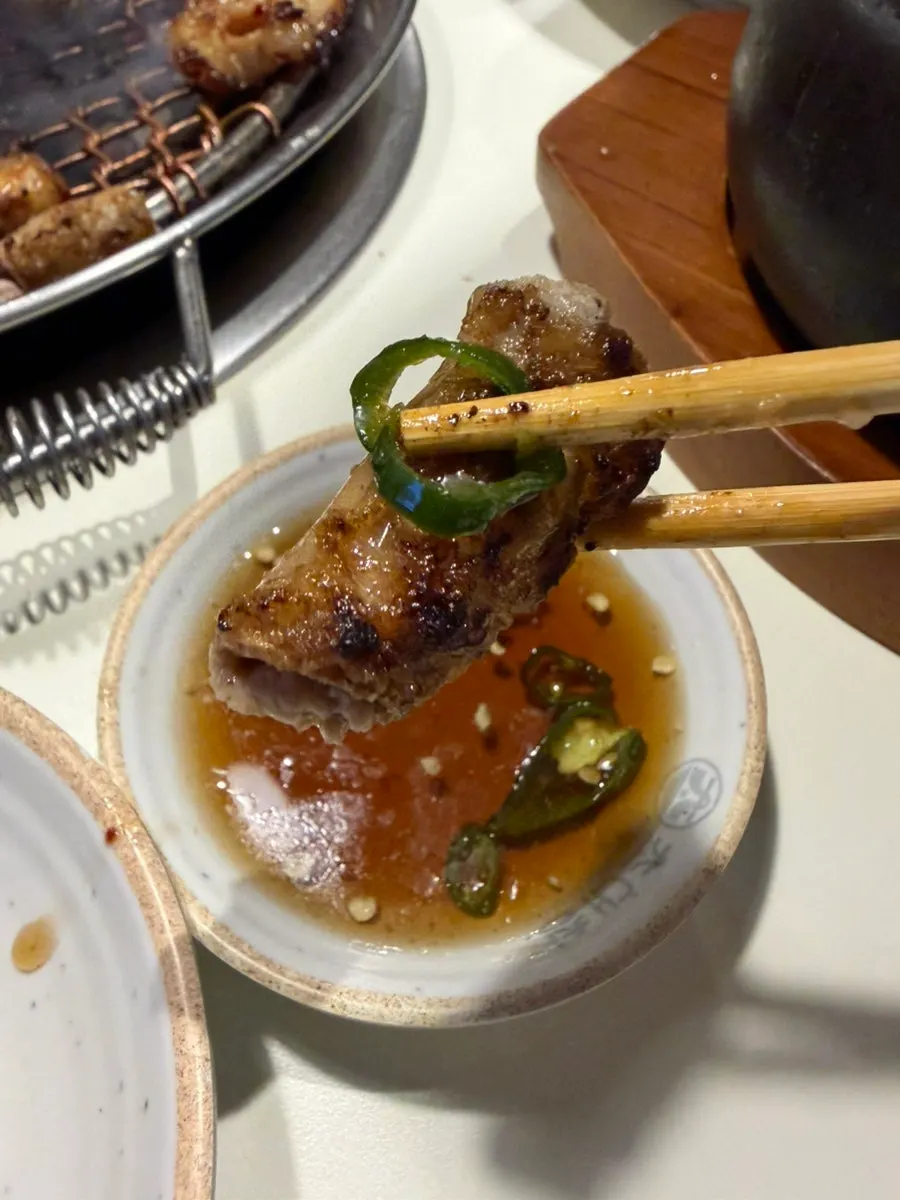 Grilled gopchang and vegetables over charcoal