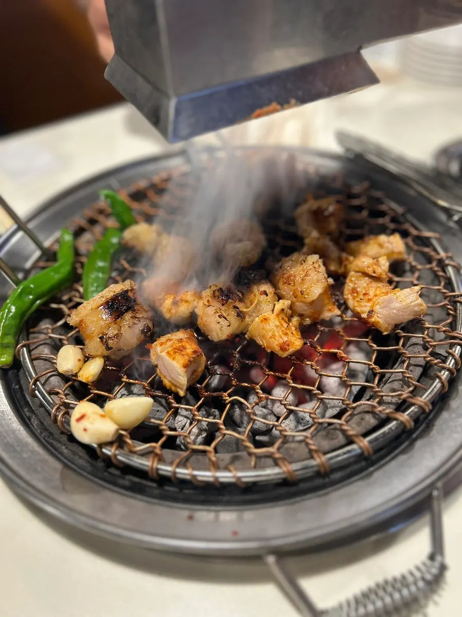 Daechang grilling under the smoke extractor