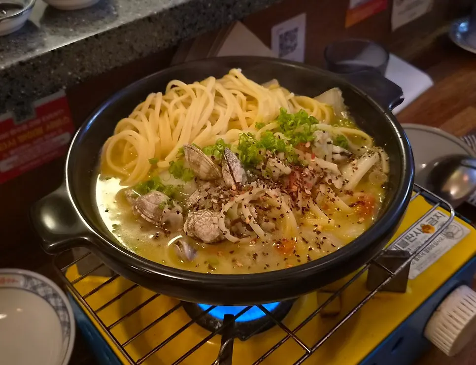 Clam sake-steam on a table burner