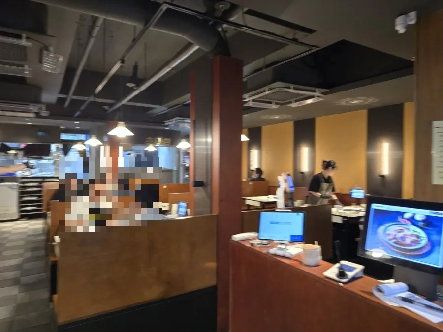 Tables full of customers inside Chodaechang Dangsan Station