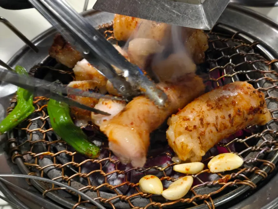 Grill under the hood sucking up the smoke