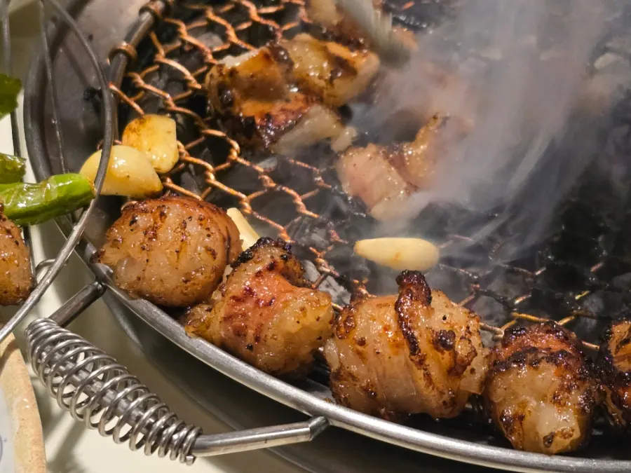 Nearly fully cooked daechang on the grill