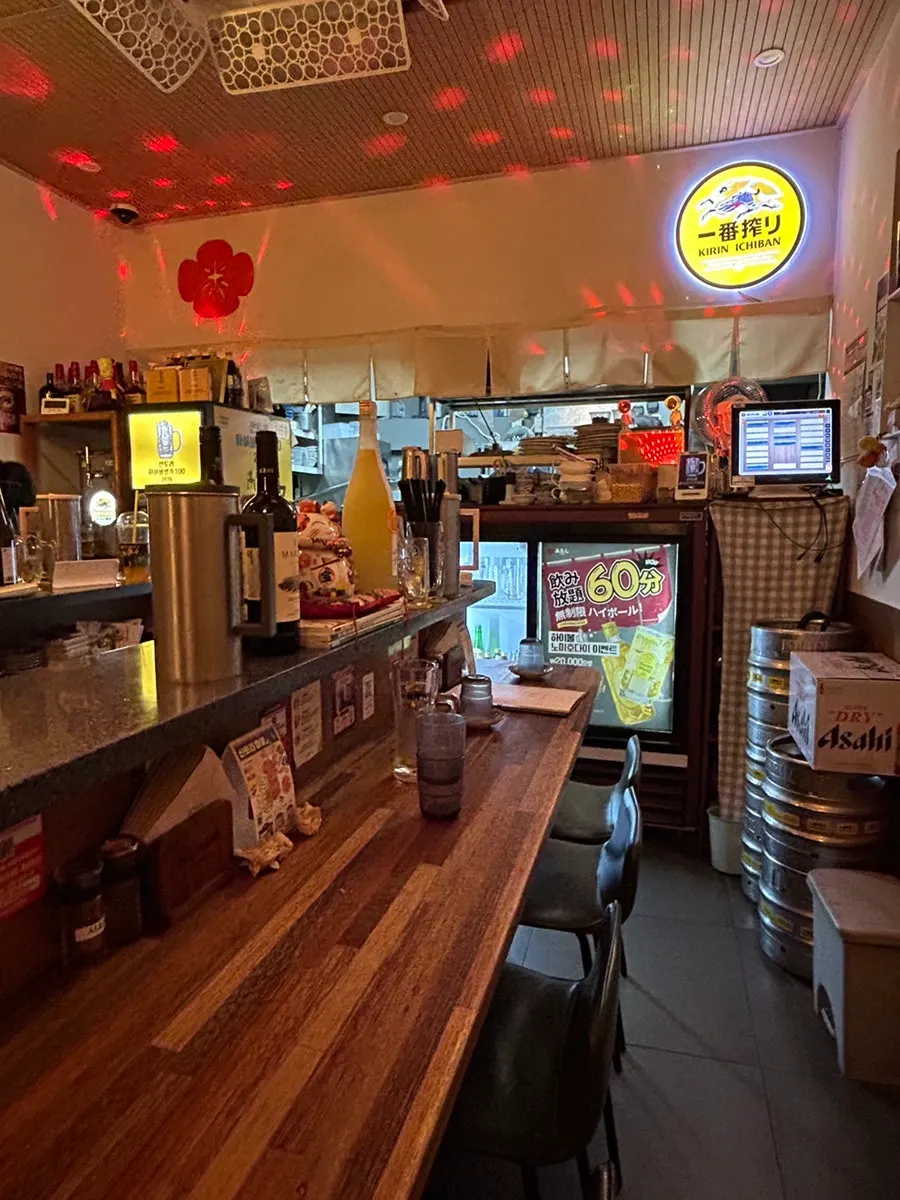 Interior of the izakaya, mostly counter seating