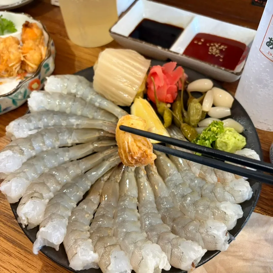 A plate of crispy fried shrimp heads