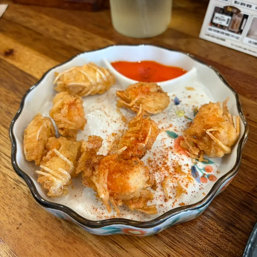 Close-up of shrimp head fry sprinkled with powder