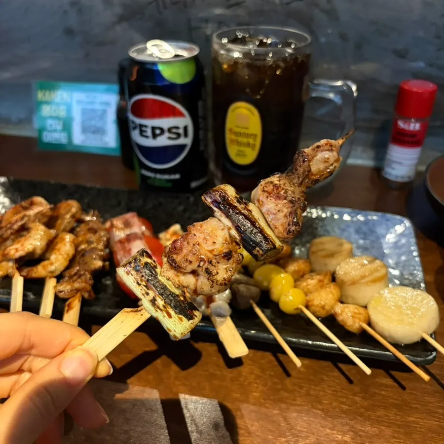 Close-up of smoky-charred skewers
