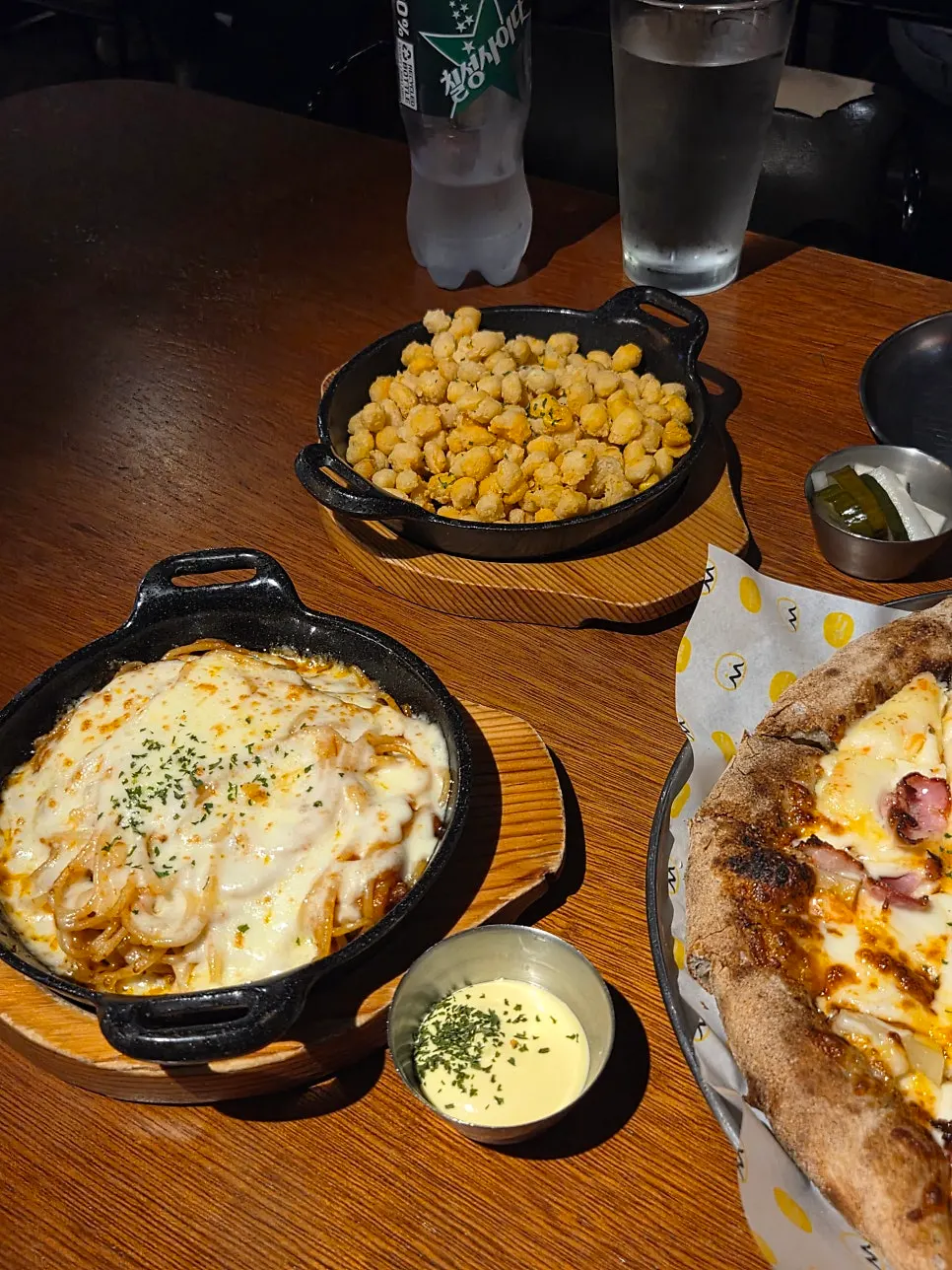 Table setting with cheese oven spaghetti and corn fritters
