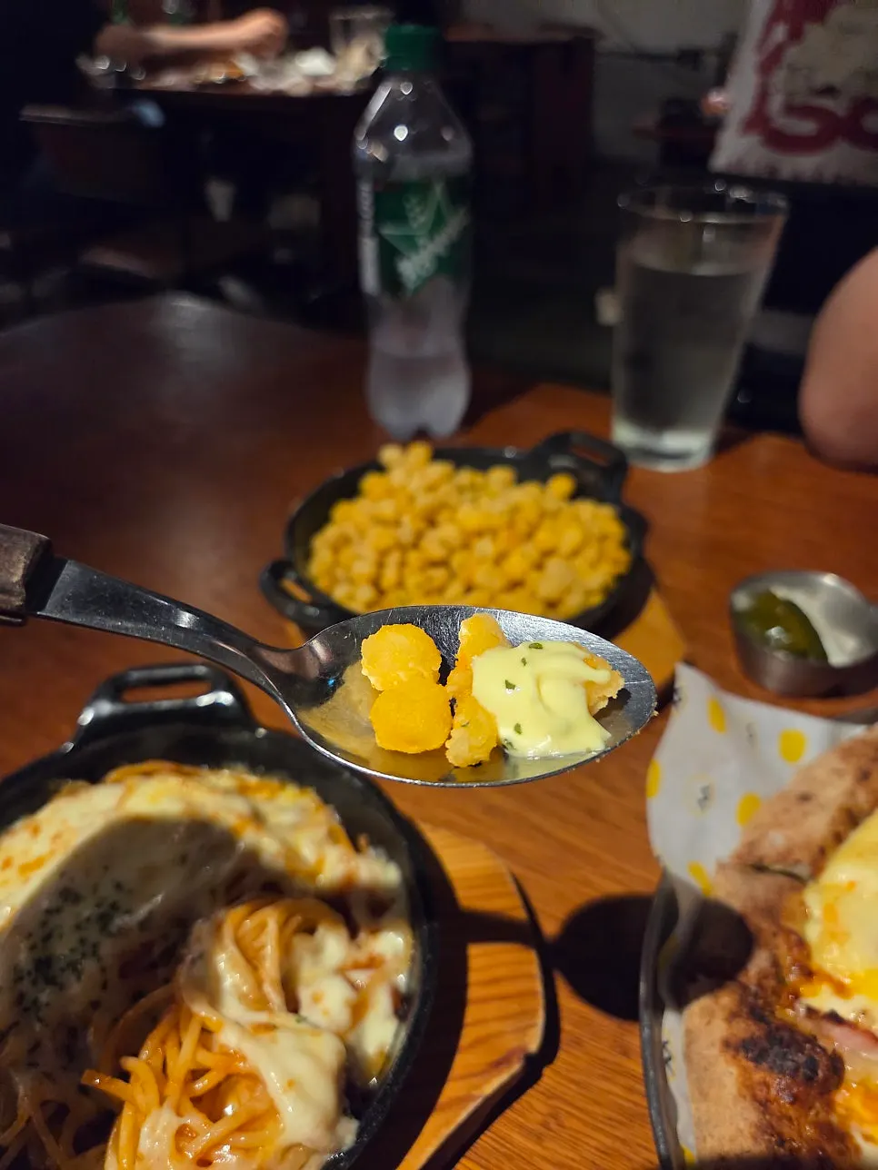Table set with pizza and side dishes together