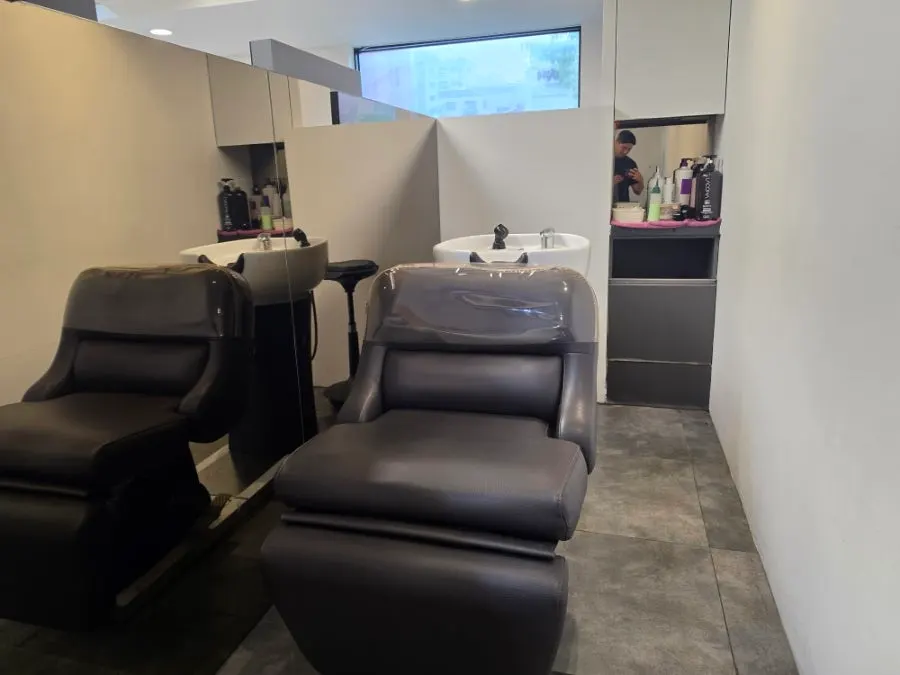 Private shampoo space divided for one person at a time
