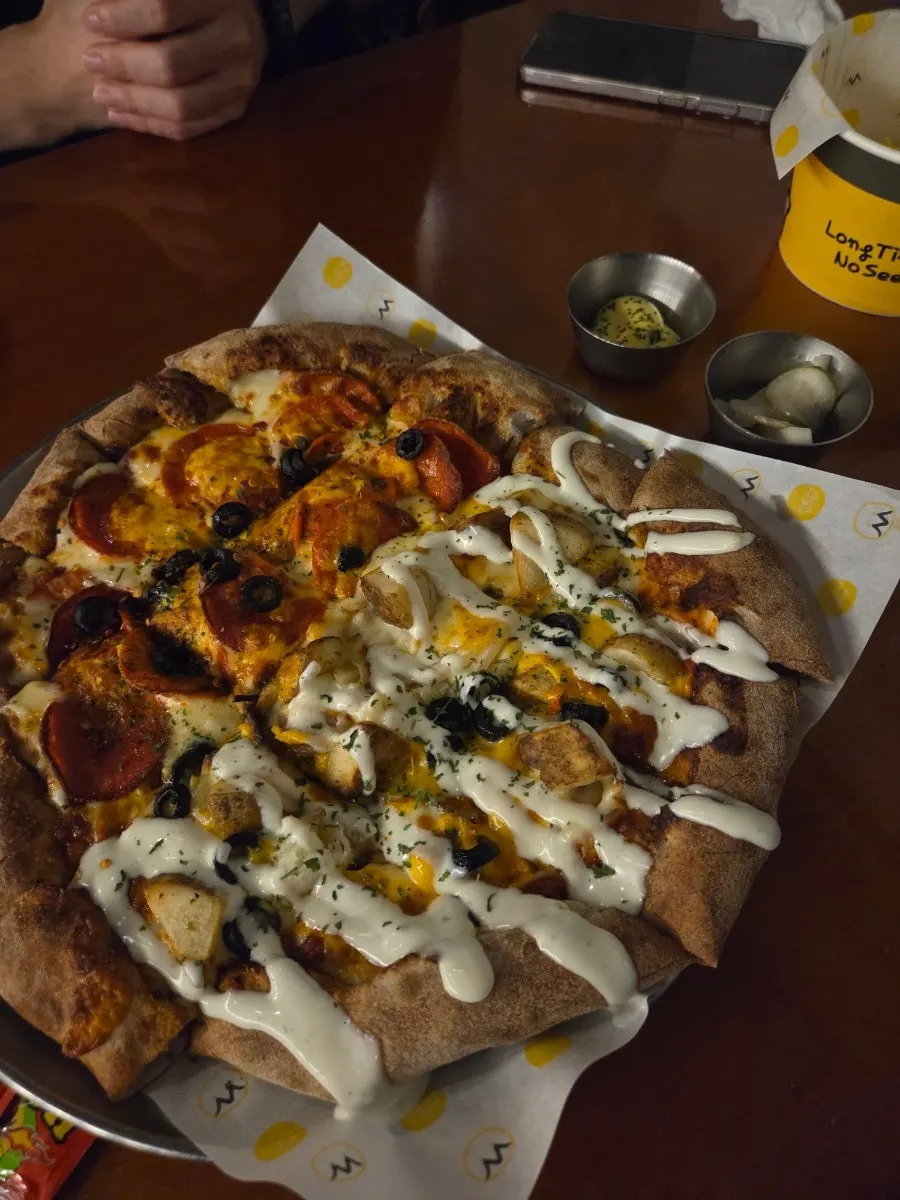 First-poured fruity beer and pizza