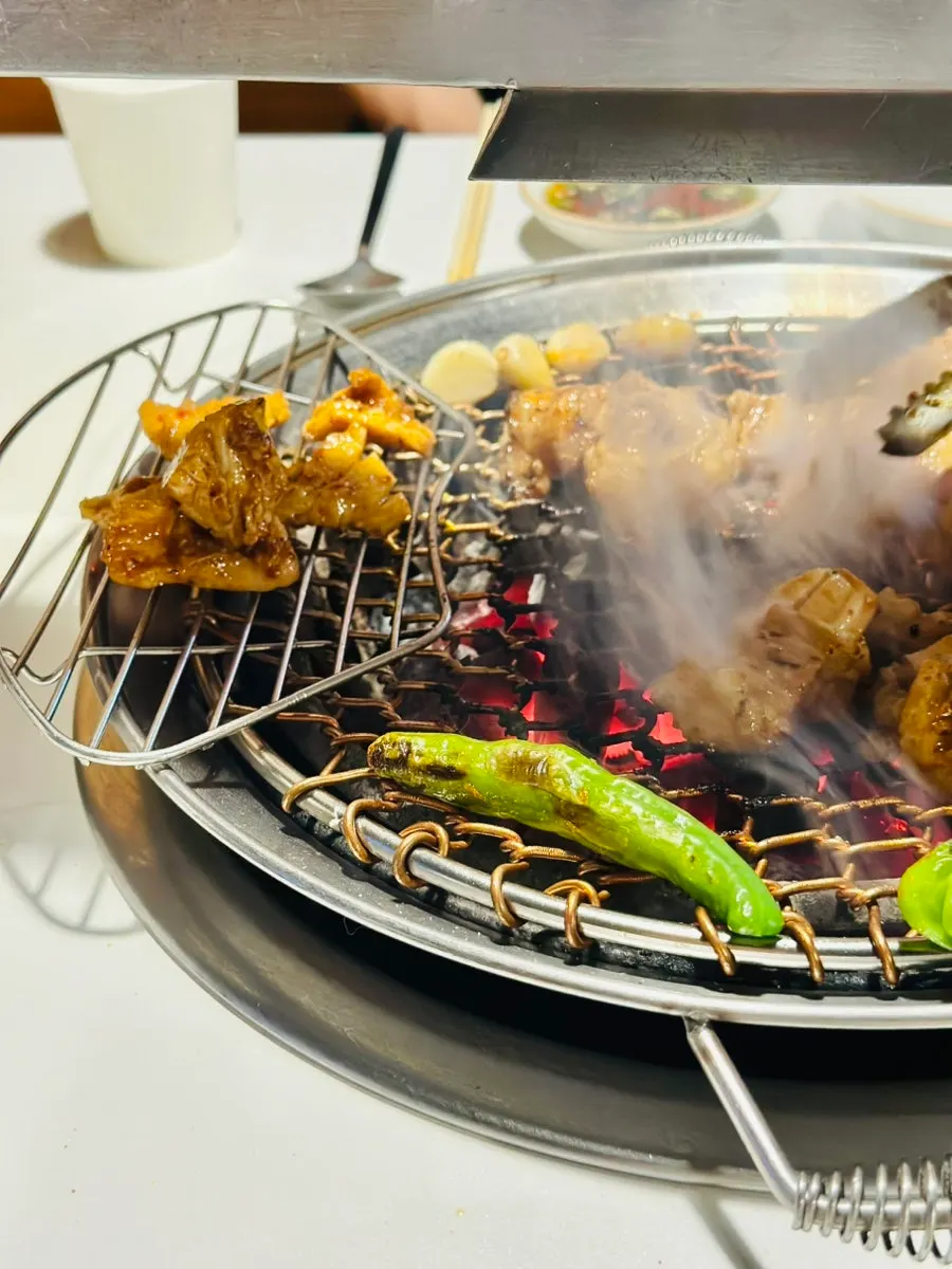 Staff grilling the assorted beef intestine platter